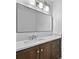Bathroom featuring wood vanity, marble countertop, and large mirror with modern lighting at 2935 Leafwood Se Dr, Marietta, GA 30067
