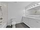 Bathroom featuring tile floors, a shower and tub, and double vanity with marble countertop at 2935 Leafwood Se Dr, Marietta, GA 30067