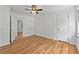 Clean, bright bedroom features wood-look flooring and a neutral wall paint, plus a closet and views outside at 2935 Leafwood Se Dr, Marietta, GA 30067
