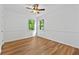 Bedroom with hardwood floors and natural lighting from surrounding windows at 2935 Leafwood Se Dr, Marietta, GA 30067