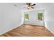 Well-lit bedroom showcasing wood-look flooring, fresh paint, and two windows offering exterior views at 2935 Leafwood Se Dr, Marietta, GA 30067