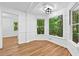 Bright breakfast nook features hardwood floors, large windows, and modern lighting at 2935 Leafwood Se Dr, Marietta, GA 30067