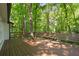 Large wooden deck with built-in seating, perfect for outdoor entertaining and enjoying nature views at 2935 Leafwood Se Dr, Marietta, GA 30067