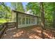 Exterior view showcasing a large back deck with access to the sunroom at 2935 Leafwood Se Dr, Marietta, GA 30067