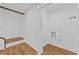 Laundry room with washer and dryer hookups, and wood-look flooring and bi-fold doors at 2935 Leafwood Se Dr, Marietta, GA 30067