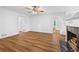 Elegant living room with fireplace, hardwood floors, and white wainscoting at 2935 Leafwood Se Dr, Marietta, GA 30067