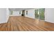 Spacious living room featuring hardwood floors, a cozy fireplace, and sliding doors to the outdoors at 2935 Leafwood Se Dr, Marietta, GA 30067
