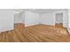 Open-plan living room with hardwood floors leading to the dining room and stairs at 2935 Leafwood Se Dr, Marietta, GA 30067