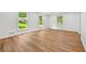 Sun-filled living room featuring hardwood floors, base trim and large windows at 2935 Leafwood Se Dr, Marietta, GA 30067