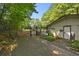 Community pool entrance with a gate, signage and a shed-like building at 2935 Leafwood Se Dr, Marietta, GA 30067