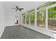 Bright sunroom with tiled floor and large windows overlooking the lush greenery at 2935 Leafwood Se Dr, Marietta, GA 30067