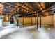 Partially finished basement featuring exposed beams and string lights at 6715 Wright Rd, Sandy Springs, GA 30328