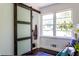 Bedroom with natural light showcasing a modern sliding barn door at 6715 Wright Rd, Sandy Springs, GA 30328