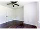 Bedroom with ceiling fan and dark wood floors at 6715 Wright Rd, Sandy Springs, GA 30328