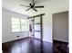 Bedroom with natural light showcasing a modern sliding barn door at 6715 Wright Rd, Sandy Springs, GA 30328