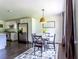 Cozy dining area with modern table and chairs adjacent to a well-equipped kitchen at 6715 Wright Rd, Sandy Springs, GA 30328