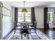 Elegant dining area with stylish decor, natural light, and a view of the outdoors at 6715 Wright Rd, Sandy Springs, GA 30328