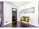 Inviting entryway featuring a dark wood door, a wooden bench with bright yellow pillows at 6715 Wright Rd, Sandy Springs, GA 30328