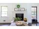 Elegant fireplace with stylish decor, complemented by natural light and modern design at 6715 Wright Rd, Sandy Springs, GA 30328