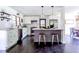Modern kitchen with white cabinetry, stainless steel appliances, marble counters, and breakfast bar at 6715 Wright Rd, Sandy Springs, GA 30328