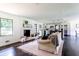 Inviting living room with a brick fireplace, comfortable seating, and open layout at 6715 Wright Rd, Sandy Springs, GA 30328