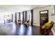 Spacious living room with hardwood floors, large windows, and an inviting seating area at 6715 Wright Rd, Sandy Springs, GA 30328
