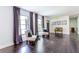 Bright living room with hardwood floors, large windows, and comfortable seating at 6715 Wright Rd, Sandy Springs, GA 30328
