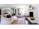 Inviting living room features a painted brick fireplace, laundry closet and stylish decor at 6715 Wright Rd, Sandy Springs, GA 30328