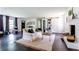 Spacious living room with modern furnishings, white brick fireplace, and dark hardwood floors at 6715 Wright Rd, Sandy Springs, GA 30328
