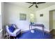 Bright office space with natural light, blue rug, and gray chair at 6715 Wright Rd, Sandy Springs, GA 30328