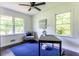 Bright office space with natural light, blue rug, and gray chair at 6715 Wright Rd, Sandy Springs, GA 30328