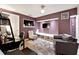 Cozy basement den featuring plush seating, modern lighting, and a relaxing atmosphere at 4031 E Meadow Dr, Duluth, GA 30096