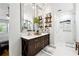 Spacious bathroom with double sink vanity, large mirrors, stylish decor and a walk-in shower at 4031 E Meadow Dr, Duluth, GA 30096