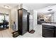 Open concept kitchen showcasing stainless steel refrigerator and access to dining and living areas at 4031 E Meadow Dr, Duluth, GA 30096