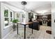 Contemporary kitchen with dark cabinets, tile floors, and stainless steel appliances at 4031 E Meadow Dr, Duluth, GA 30096