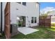 Cozy back patio with sliding glass doors offering seamless indoor-outdoor living and a fenced yard at 4627 Piston Sw Jct, Mableton, GA 30126