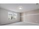 The bedroom offers carpet and two windows with neighborhood views at 4627 Piston Sw Jct, Mableton, GA 30126