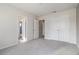 This bedroom has neutral walls, carpet, and two closets at 4627 Piston Sw Jct, Mableton, GA 30126