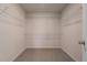 Spacious walk-in closet with neutral walls and wire shelving for optimal storage and organization at 4627 Piston Sw Jct, Mableton, GA 30126