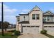 Charming two-story townhome with a brick and gray facade, two-car garage, and well-maintained landscaping at 4627 Piston Sw Jct, Mableton, GA 30126