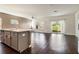 Modern kitchen with gray cabinets, a white quartz island, stainless steel appliances, and hardwood floors at 4627 Piston Sw Jct, Mableton, GA 30126