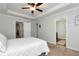 This bedroom has neutral walls, carpet and an ensuite entrance to the bathroom at 5414 Sycamore Rd, Oakwood, GA 30518