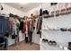 This large walk-in closet features an abundance of shelving and closet rod space for storage at 5414 Sycamore Rd, Oakwood, GA 30518