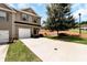 Charming exterior view featuring a well-manicured lawn and ample parking space at 5414 Sycamore Rd, Oakwood, GA 30518
