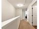 The upstairs hallway has access to the bedrooms and carpet throughout at 5414 Sycamore Rd, Oakwood, GA 30518