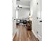 Bright hallway with wood-look flooring leading to a sunlit living area at 5414 Sycamore Rd, Oakwood, GA 30518