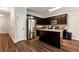 Well-equipped kitchen with stainless steel appliances and dark wood cabinets at 5414 Sycamore Rd, Oakwood, GA 30518