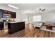 Open concept kitchen with stainless steel appliances and an adjacent living area at 5414 Sycamore Rd, Oakwood, GA 30518