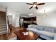 Cozy open-concept living space with a staircase, kitchen, and comfortable furniture at 5414 Sycamore Rd, Oakwood, GA 30518