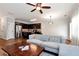 Cozy open-concept living space with a sofa, kitchen, and comfortable furniture at 5414 Sycamore Rd, Oakwood, GA 30518